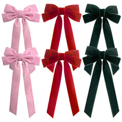 Velvet Bows Hair Clips in red add chic holiday flair to everyday hairstyles