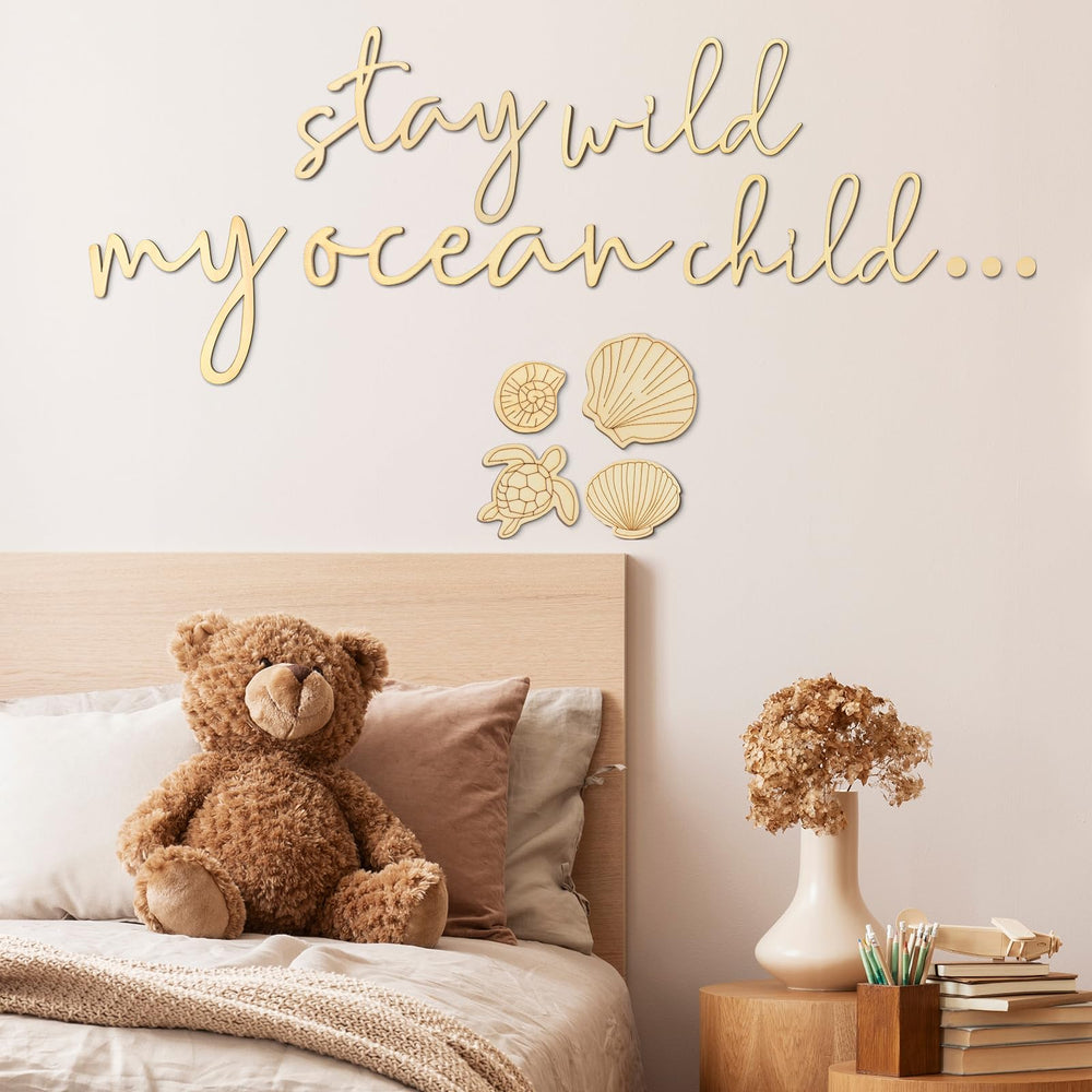 Vercraft Stay Wild My Ocean Child sign on natural wood finish adds calming nursery ambiance.