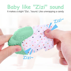 Vicloon teething mitt on baby hand, keeps hands free for toys and exploration.