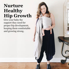 Vlokup ring sling carrier worn by parent demonstrating ergonomic support.