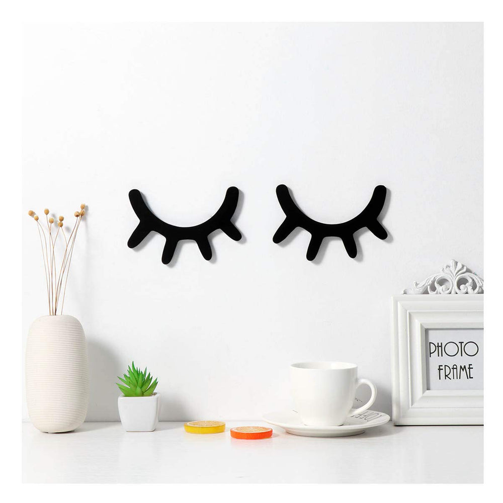 Vosarea Sleepy Eyes wall decor pair in black adds nursery charm and whimsy.