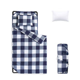Wake In Cloud cot nap mat rolled with handle for easy daycare portability.