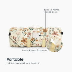 Wake In Cloud cot nap mat rolled with handle demonstrates portable design for daycare and travel.