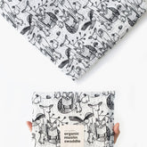 Wee Gallery forest animals swaddle close-up texture, breathable organic cotton for gentle comfort.