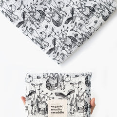 Wee Gallery forest animals swaddle close-up texture, breathable organic cotton for gentle comfort.