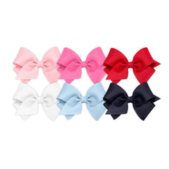 Wee Ones bows on WeeStay clip closeup showing secure grip for daily wear.