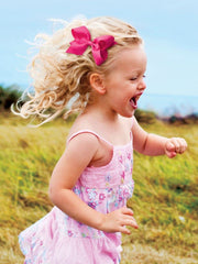 Wee Ones bows on a child’s head illustrate easy daily styling.