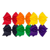 Wee Ones solid grosgrain bows on a WeeStay clip closeup for secure daily wear.