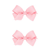 Wee Ones two-pack mini light pink grosgrain bows with a no-slip clip for secure wear.
