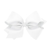 Wee Ones classic French satin bow in King white on a WeeStay clip for secure all-day wear.