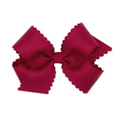 Wee Ones classic grosgrain bow front view on WeeStay clip for secure all-day wear.