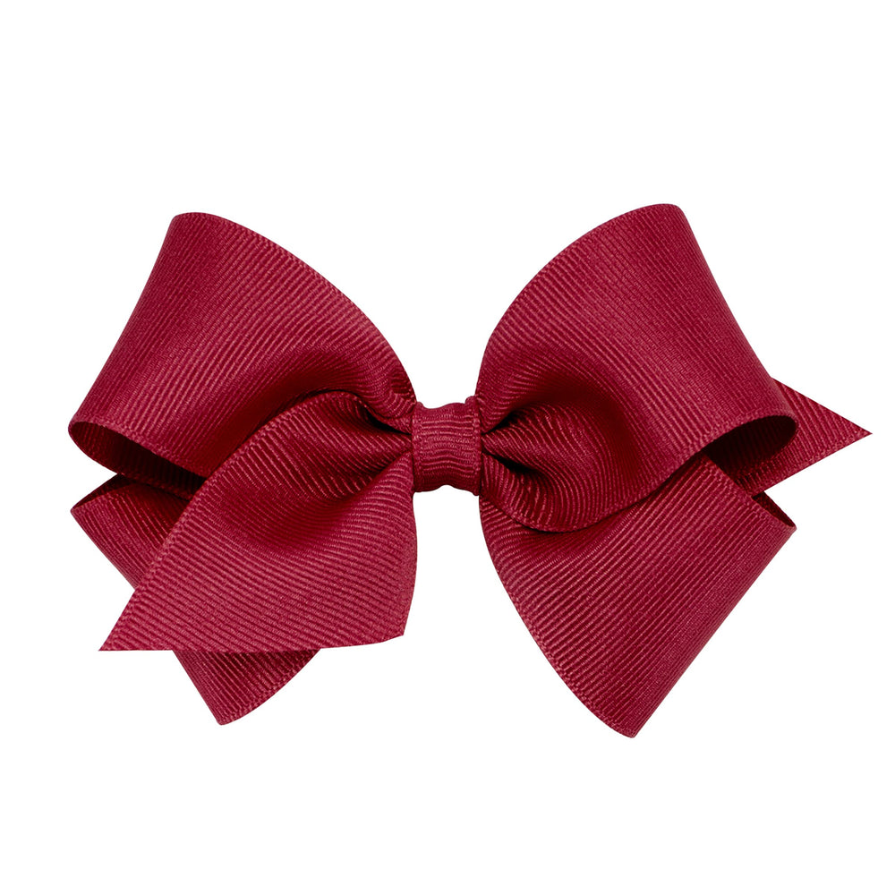 Wee Ones cranberry grosgrain bow on WeeStay clip for secure all-day wear during active days.