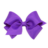 Wee Ones Delphinium wrap bow on no-slip clip keeps hair secure and stylish all day.