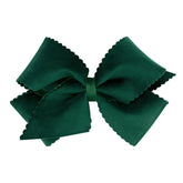 Wee Ones forest green bow with scalloped-edge velvet overlay for elegant everyday wear.