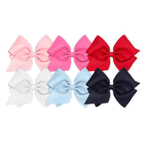 Wee Ones white mini king bow on WeeStay clip for secure all-day style.