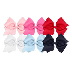 Wee Ones white mini king bow on WeeStay clip for secure all-day style.