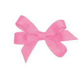 Wee Ones hot pink grosgrain bow on WeeStay clip stays put through playtime