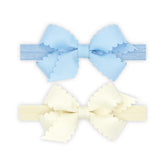 Wee Ones mini scalloped bows on elastic bands ideal for everyday outfits.