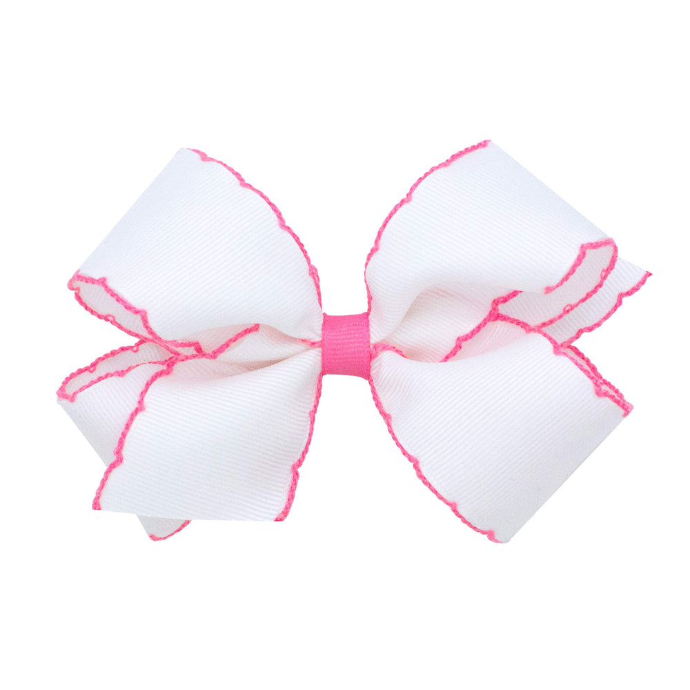 Wee Ones Moonstitch edge bow closeup shows durable grosgrain with white-pink trim