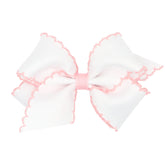 Wee Ones moonstitch bow on WeeStay clip, white with light pink edge adds everyday charm.
