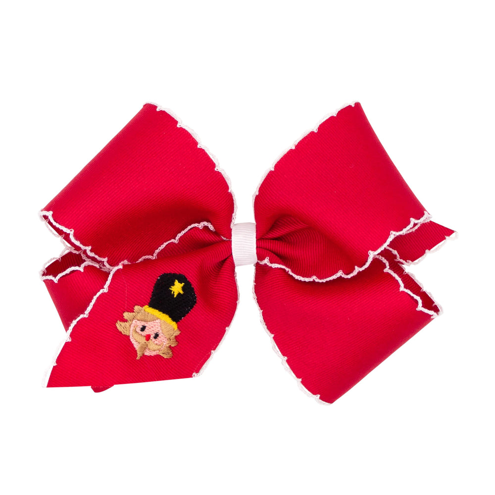 Wee Ones Moonstitch embroidery bow on WeeStay clip for secure holiday styling.
