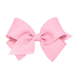 Wee Ones Pearl Pink bow on a hair clip adds timeless charm to everyday outfits.