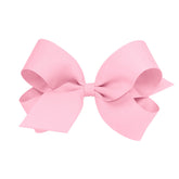 Wee Ones pink classic grosgrain bow on WeeStay clip for secure all-day wear