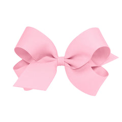 Wee Ones pink classic grosgrain bow on WeeStay clip for secure all-day wear
