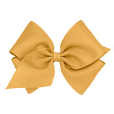 Wee Ones plain wrap grosgrain bow on WeeStay clip in Old Gold offers secure all-day hold.