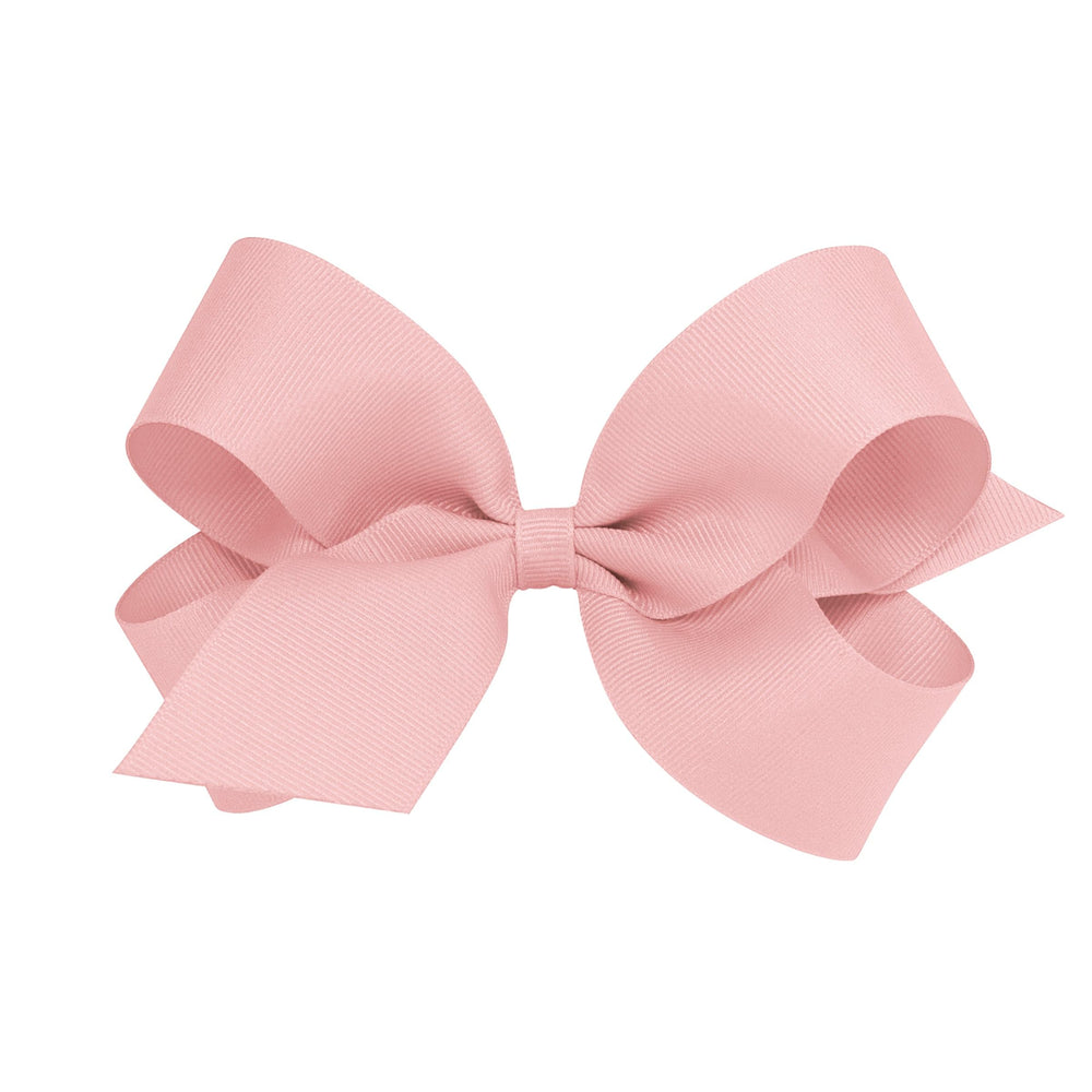 Wee Ones Sweet Nectar bow on WeeStay clip keeps hair in place for everyday wear.