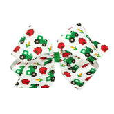 Wee Ones tractor-printed grosgrain hair bow front view adds playful farm charm to any outfit.