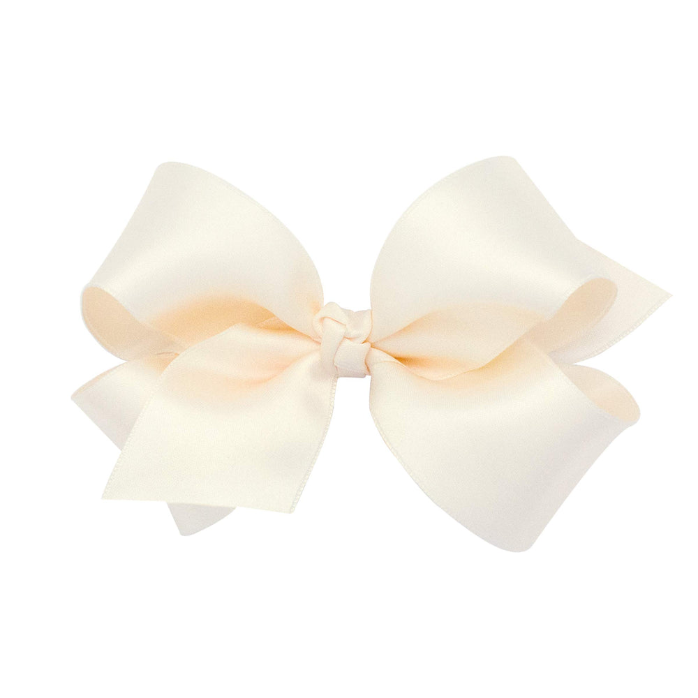 Wee Ones WeeStay bow on clip in ecru provides secure all-day wear for active kids.