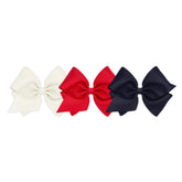 Wee Ones WeeStay No-Slip Clip closeup on solid grosgrain texture for secure daily wear.