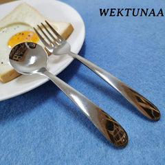 WEKTUNAA kids fork with ergonomic handle close-up demonstrates comfortable grip for small hands.