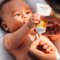 Weleda Calendula Baby Face Cream packaging on shelf, natural skincare choice for babies.