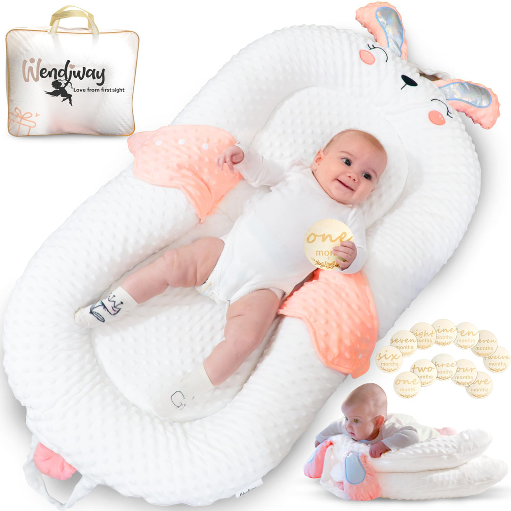 WENDIWAY infant support pillow with pink side panels provides gentle, secure supervised positioning.