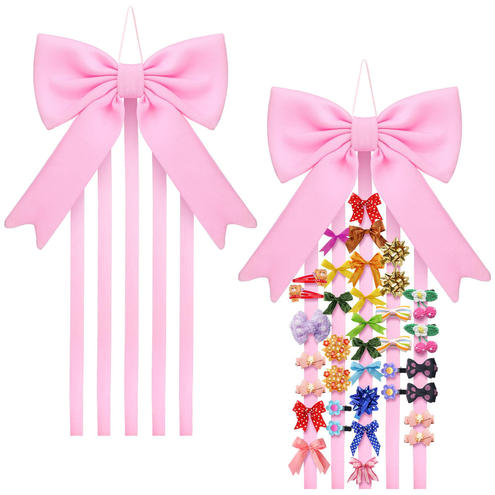Weysat bow organizer on wall with pink bow and five ribbons for hair clips.