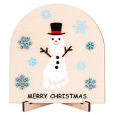Whaline First Christmas footprint sign close-up snowman design for keepsake photos