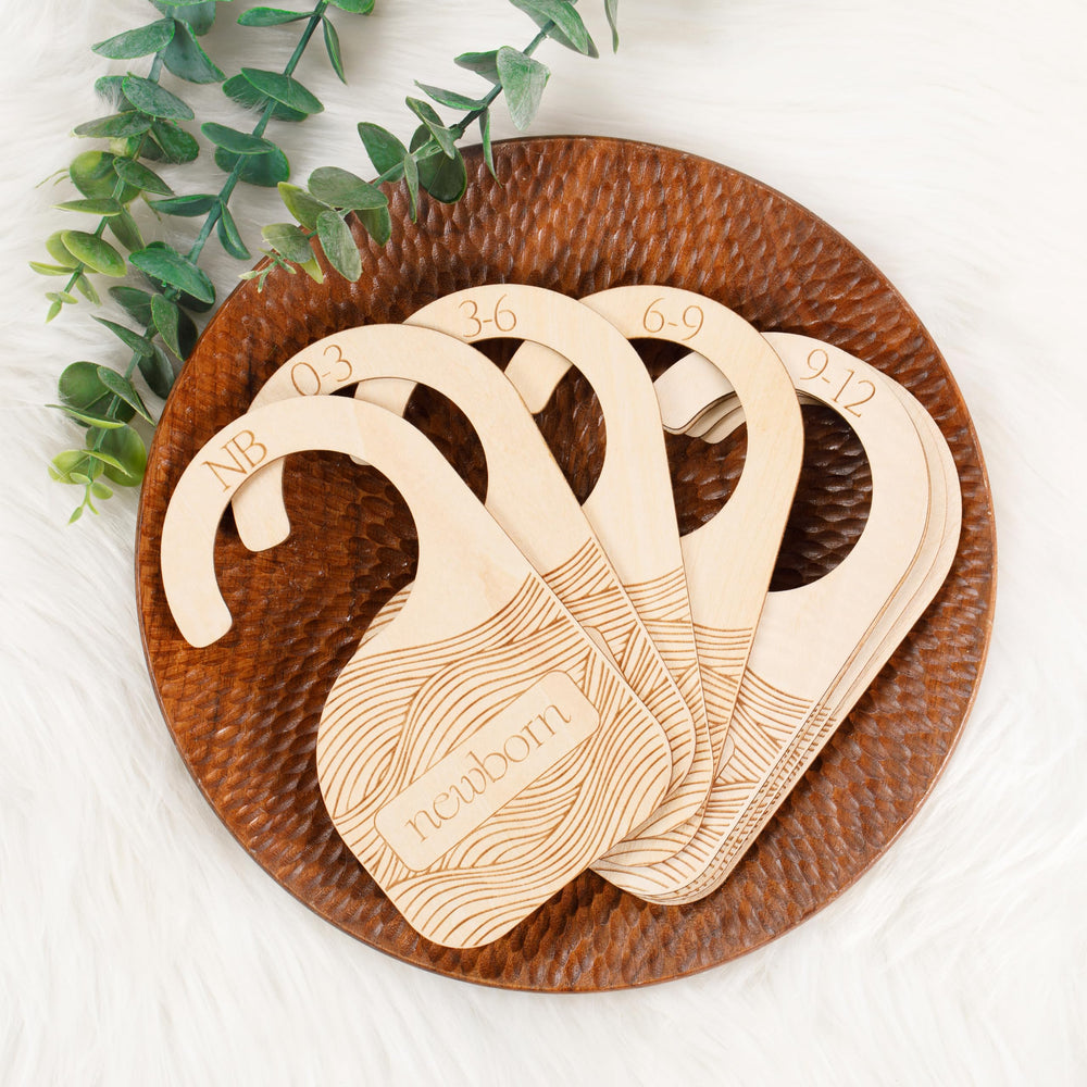 Whitluck's Baby Closet Dividers front view shows durable wood for tidy newborn to toddler outfits.