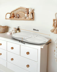Widitn non-slip bottom in action reduces shifting during diaper tasks.