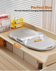 Widitn pad has raised sides to enhance baby safety during changes