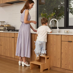 Wiifo wooden step stool in bathroom shows easy reach for brushing teeth.