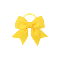 Wistamik yellow bow hair clip close-up showing silky ribbon texture.