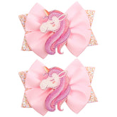 WIWUFUE pink glitter unicorn hair bow clip close-up for party-ready hairstyles.