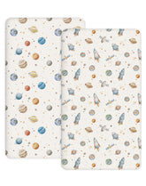 Woodiville Stellar Adventure crib sheet showing snug fit on 28x52 crib mattress with secure edge elastic.
