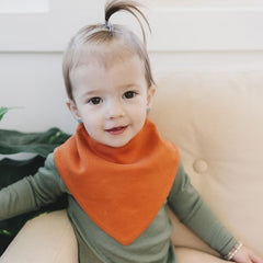 Woolino Merino baby bibs absorbency closeup shows soft merino interior and cotton exterior.