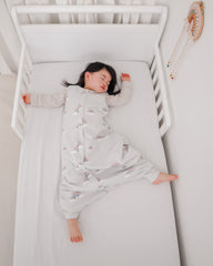 Woolino sleep bag foot openings enabling toddler movement during awake time.