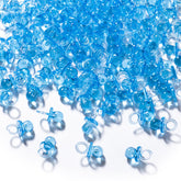 XINHUIDALSQ blue mini acrylic pacifiers scattered on a table for party decor