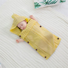 XMWEALTHY turmeric swaddle demonstrates blanket-to-sleeping-bag versatility.