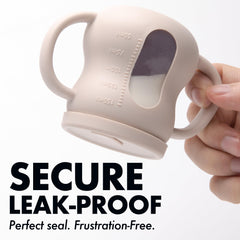 XPECIAL baby training cup beige see-through body for quick cleanliness checks.